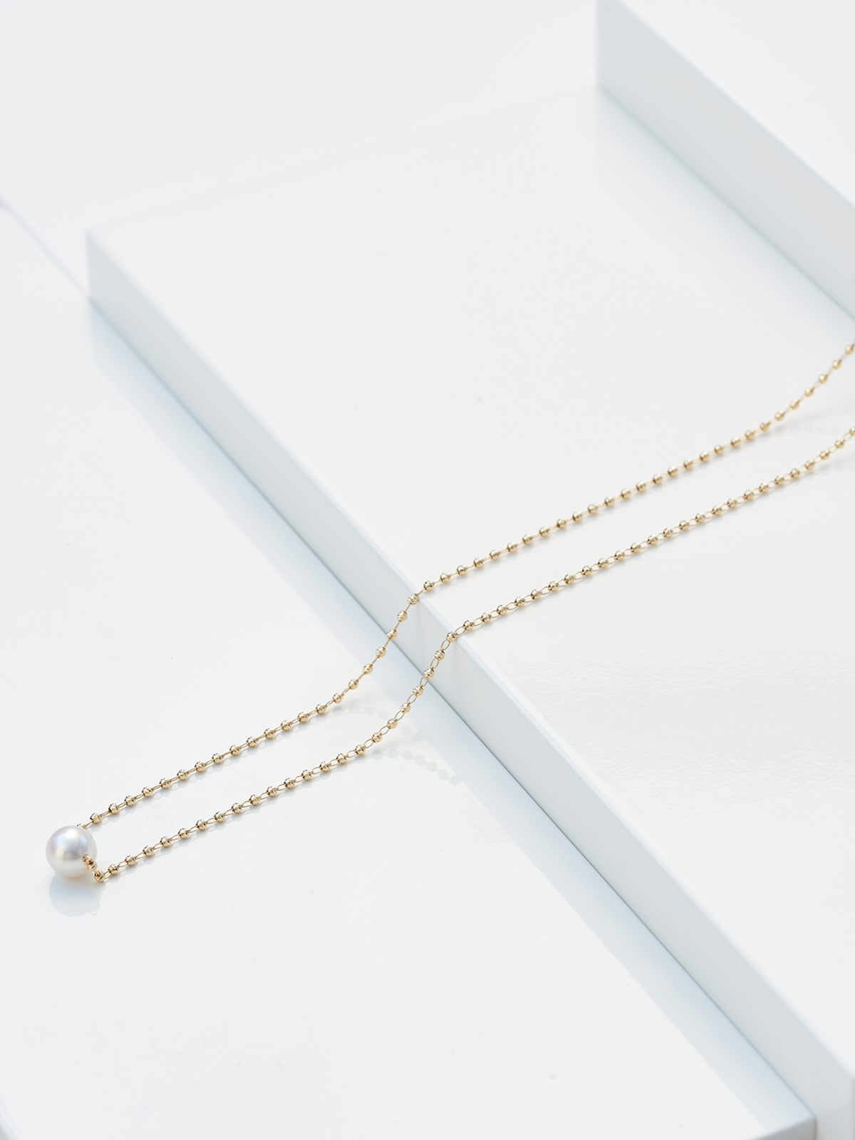 Effektvolle lange Goldkette mit Akoya Perle