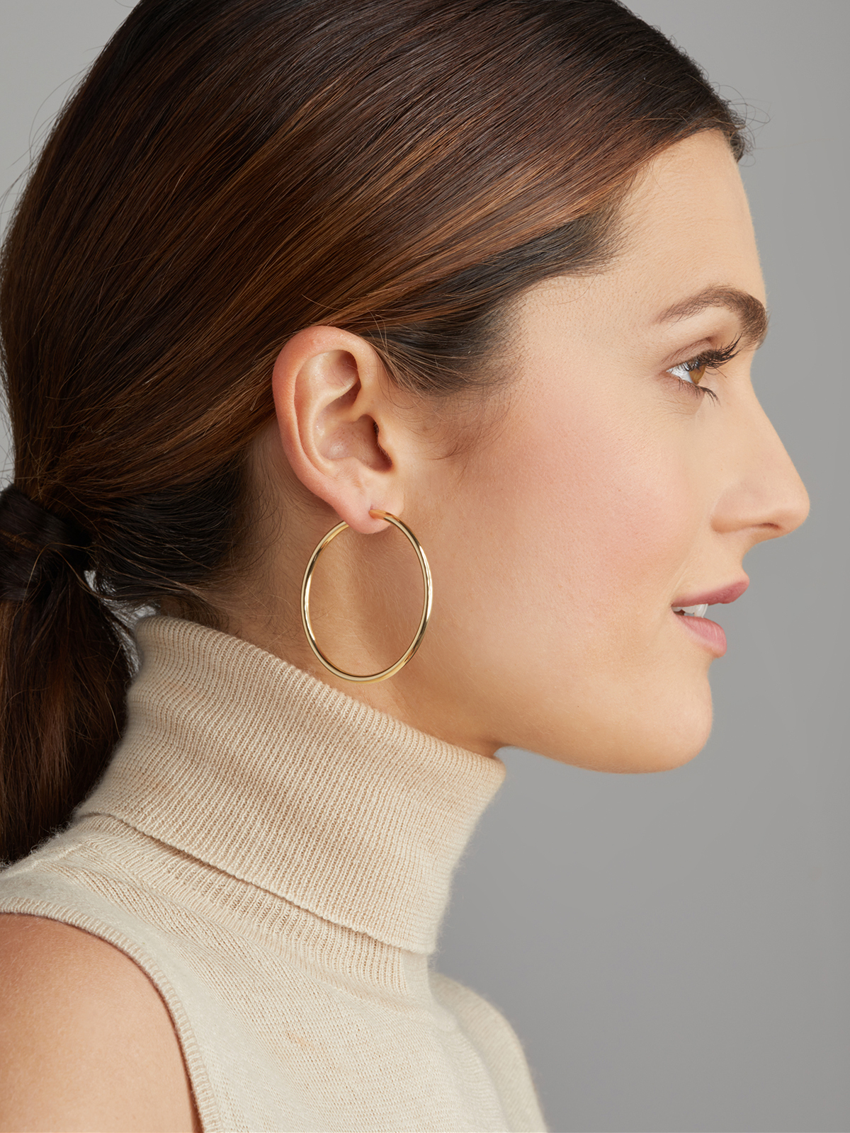 Large yellow gold hoop earrings with detachable pearls