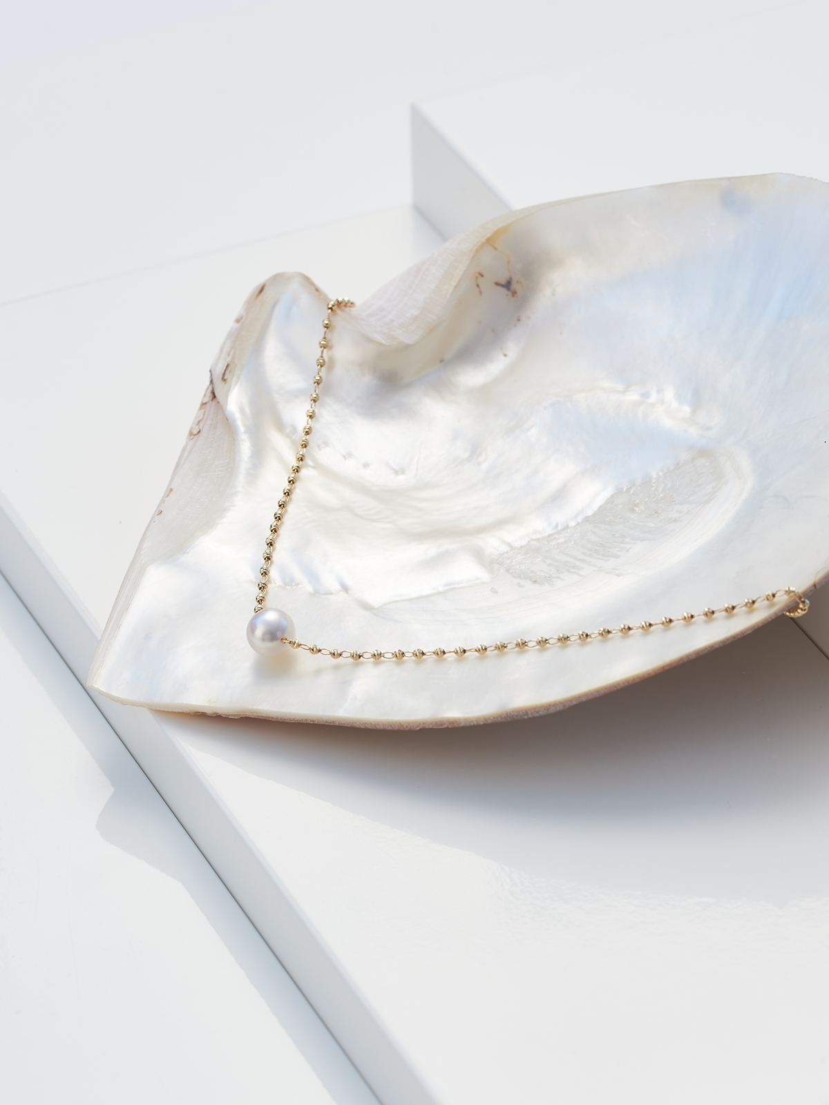 Effektvolle lange Goldkette mit Akoya Perle