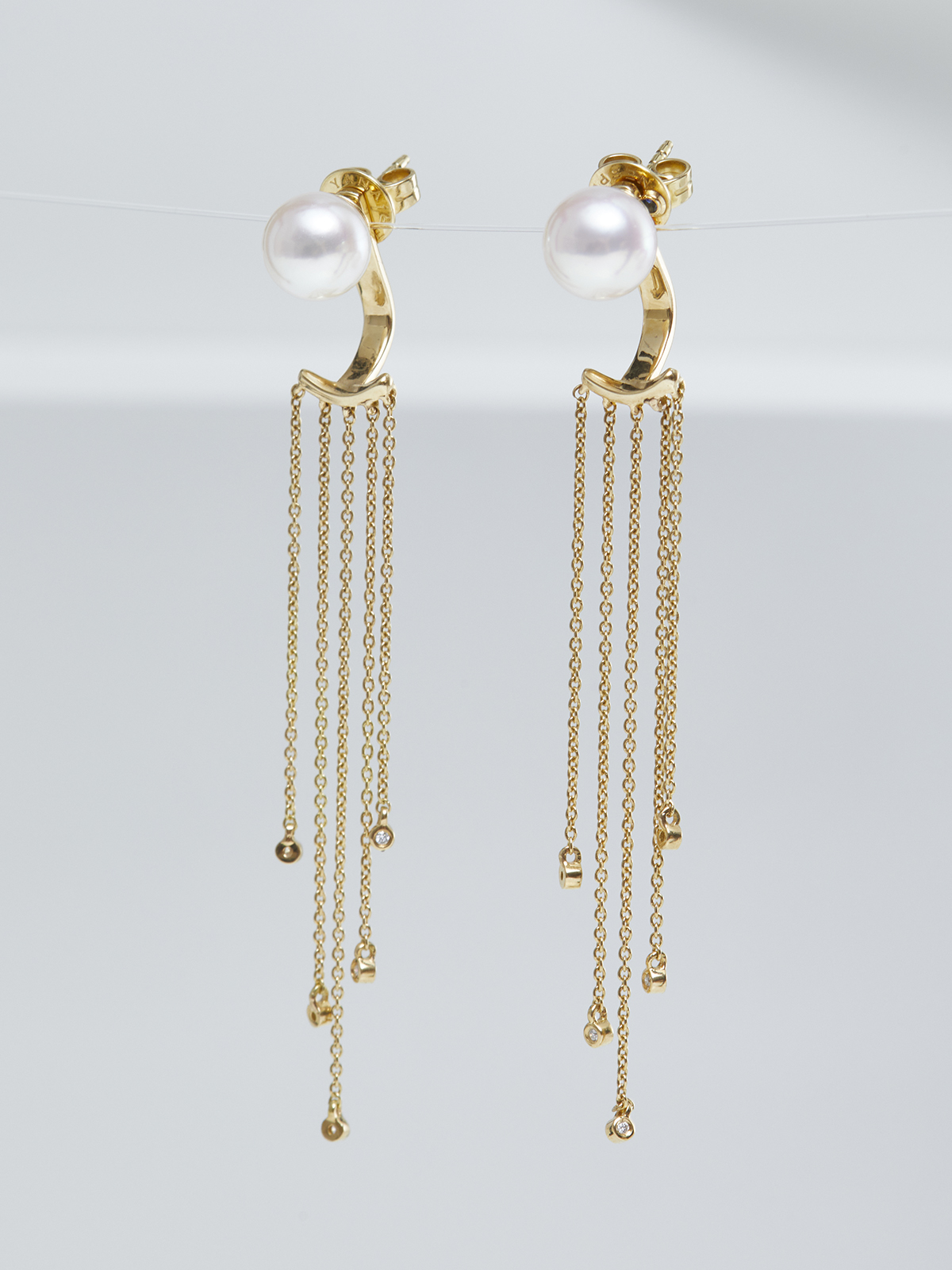 Opulent pearl earrings with diamonds